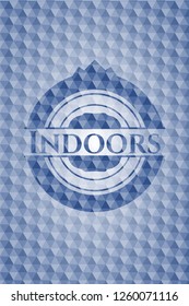 Indoors blue badge with geometric pattern.