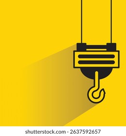 industrial crane hook icon with drop shadow on yellow background