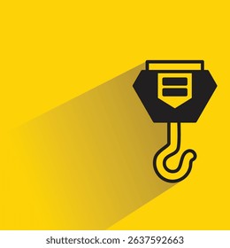industrial crane hook icon with drop shadow on yellow background