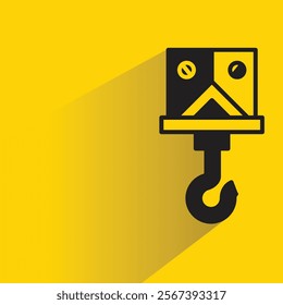 industrial crane hook icon with shadow on yellow background