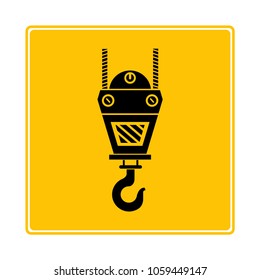 industrial hook symbol in yellow background