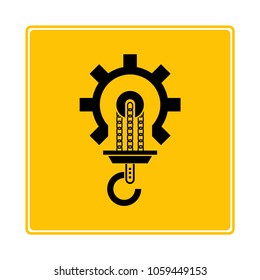 industrial hook symbol in yellow background