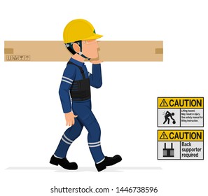 An industrial worker is carrying a long paper crate