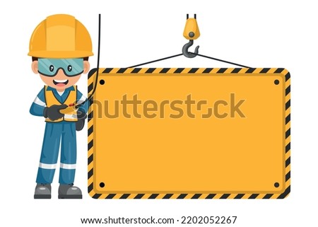 Industrial worker handling overhead crane holding sign with space to copy and paste text. Personal protection equipment. Safety first sign. Industrial safety and occupational health at work