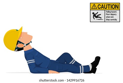 An industrial worker is lying down on the floor
