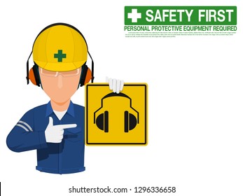 Industrial worker is presenting earmuffs sign