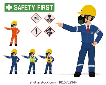 An industrial worker with respirator is pointing to something.
