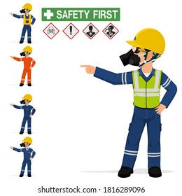 An industrial worker with respirator is pointing to something.
