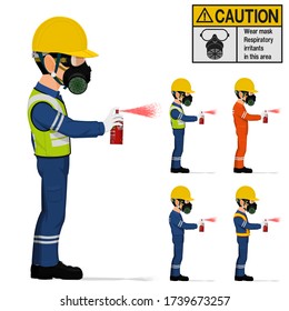 An industrial worker with respirator is spraying color.
