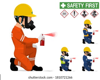 An industrial worker with respirator is spraying color
