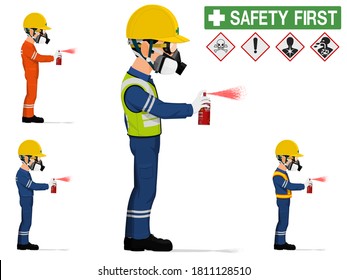 An industrial worker with respirator is spraying color
