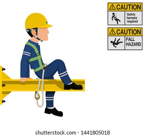 An industrial worker with safety harness is working at height
