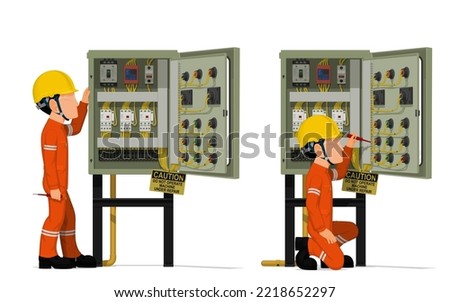 Industrial workers use screwdriver tester to measuring electric current in the electrical control cabinet