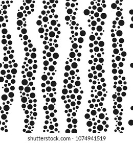 Infinite seamless pattern of black circles on a white background