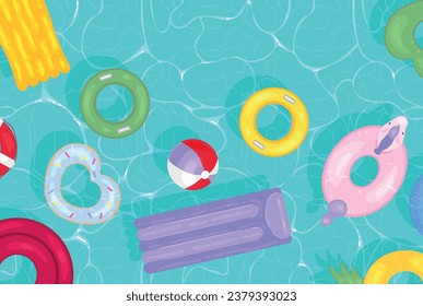 Inflatable rings and mattresses in swimming pool, top view