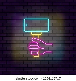 Influencer, selfie, smartphone neon vector icon on dark wall background. Neon Influencer, selfie, smartphone vector icon