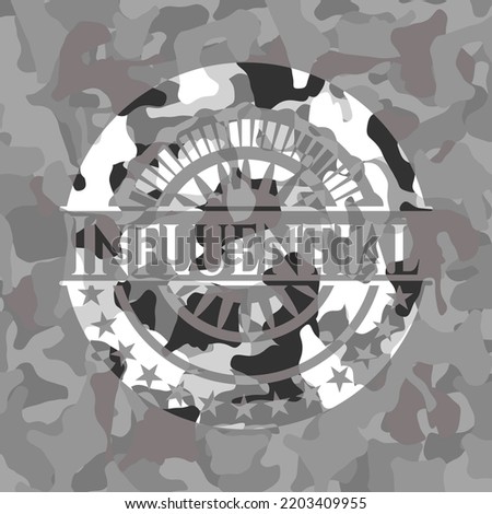 Influential written on a grey camouflage texture 