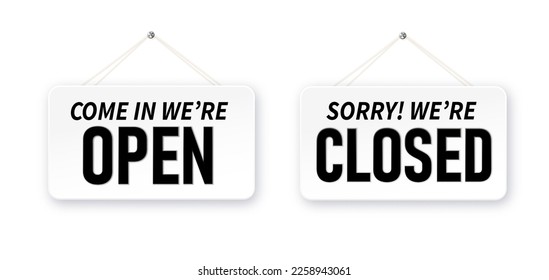 Information boards with Come in we're open and Sorry, We are closed. White signboard with a rope on background. Business concept for closed and open businesses, sites and services