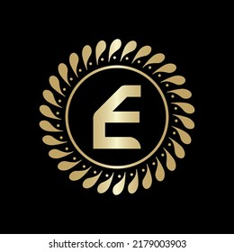  Initial E Golden leaf and circle logo design vector. Golden beauty E Logo and business symbol and alphabets vector design