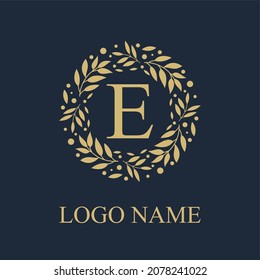 Initial E Letter in Circle Leaves Wreath Frame for Cosmetic, Make up, Fashion, Hotel, Resto, Resort, Real Estate, Apartment Business Logo Vector Template