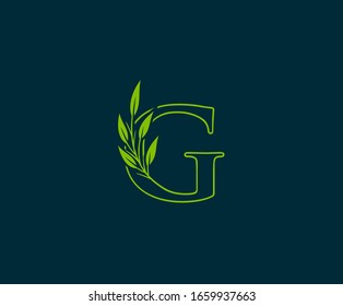 Initial G letter with green leaves logo