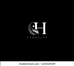 Initial H letter luxury beauty flourishes ornament monogram logo