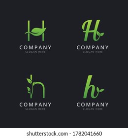 Initial H logo with leaf elements in green color