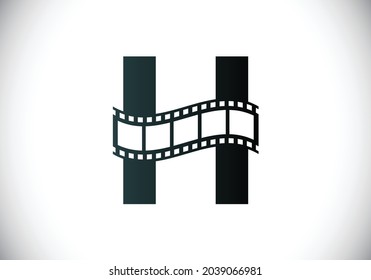 Initial H monogram alphabet incorporated with film reel. Video and movie logo concept. Font emblem. Logo for the entertainment business and company identity