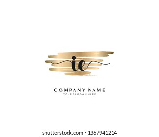 IE initial handwriting logo with brush gold color template vector