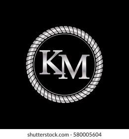 initial k and m logo silver metallic with metal circle rope frame border decorative