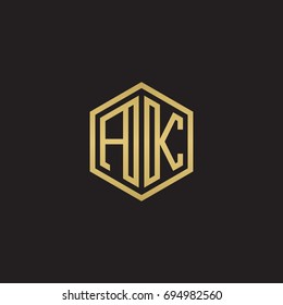 Initial letter AK, minimalist line art hexagon logo, gold color on black background