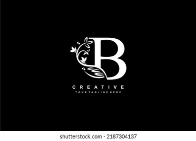 initial letter B logo design with beautiful and elegant flower and feather decoration. initial B design. icon B. design B
