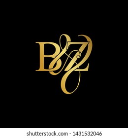 Initial letter B & Z BZ luxury art vector mark logo, gold color on black background.