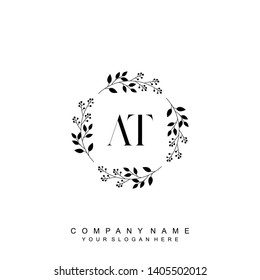 Initial letter AT beautiful handwriting logo vector template