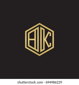 Initial letter BK, minimalist line art hexagon logo, gold color on black background