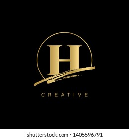 Initial Letter brush H Monogram Sliced. Gold Logo template isolated on black background