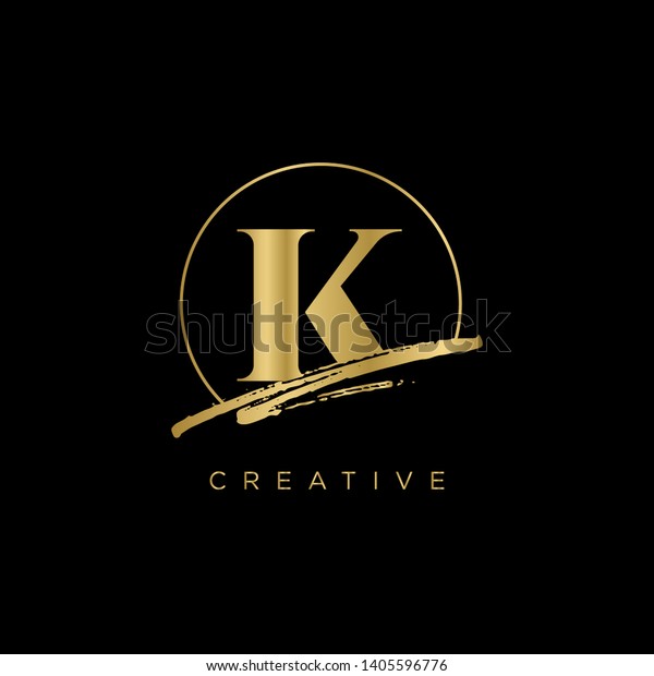 Initial Letter brush K Monogram Sliced.\
Gold Logo template isolated on black\
background