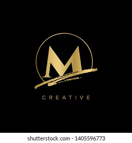 Initial Letter brush M Monogram Sliced. Gold Logo template isolated on black background