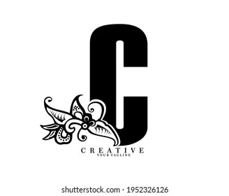 the initial letter C is in the form of a logo decorated with a batik pattern. beautiful, elegant, luxurious. black white monogram logo ornament. batik fonts