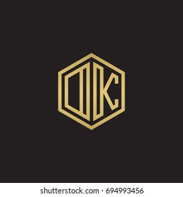 Initial letter DK, OK, minimalist line art hexagon logo, gold color on black background
