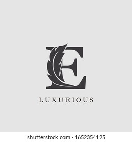 Initial Letter E Logo Luxury feather vector design for luxuries business 