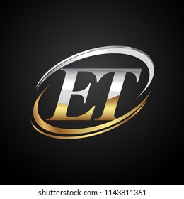 initial letter ET logotype company name colored gold and silver swoosh design. isolated on black background.