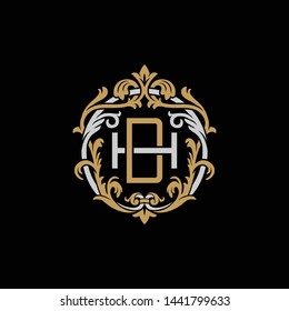 Initial letter H and D, HD, DH, decorative ornament emblem badge, overlapping monogram logo, elegant luxury silver gold color on black background