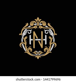 Initial letter H and N, HN, NH, decorative ornament emblem badge, overlapping monogram logo, elegant luxury silver gold color on black background