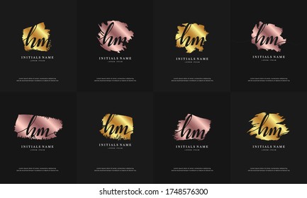 letra inicial HM H M conjunto de logotipo de escritura a mano plantilla de diseño con pincel abstracto en color rosa dorado y dorado