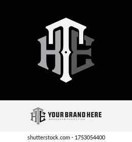 Lettre initiale HTE, HET, THE, TEH, ETH ou EHT qui se chevauchent, interlock, logo monogramme, couleur blanche et grise sur fond noir