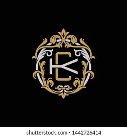 Initial letter K and C, KC, CK, decorative ornament emblem badge, overlapping monogram logo, elegant luxury silver gold color on black background