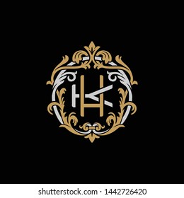 Initial letter K and H, KH, HK, decorative ornament emblem badge, overlapping monogram logo, elegant luxury silver gold color on black background