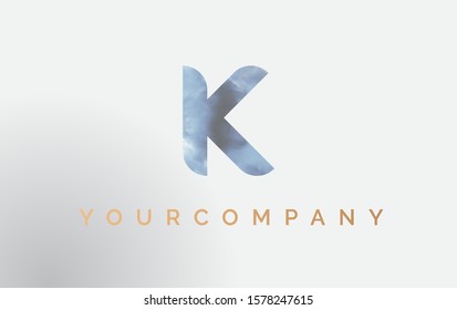 Initial letter K Logo Isolated on blue. Vector Smoke