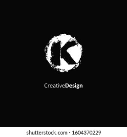 Initial letter K logo with splash element. Vector logo design template